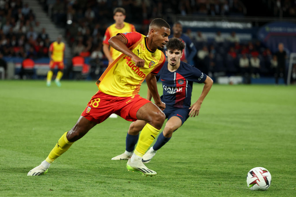 Andy Diouf of Lens, Vitinha of PSG in action during the Ligue 1 Uber Eats match between Paris Saint-Germain (PSG) and RC Lens (RCL) at Parc des Princes stadium on August 26, 2023 in Paris, France.