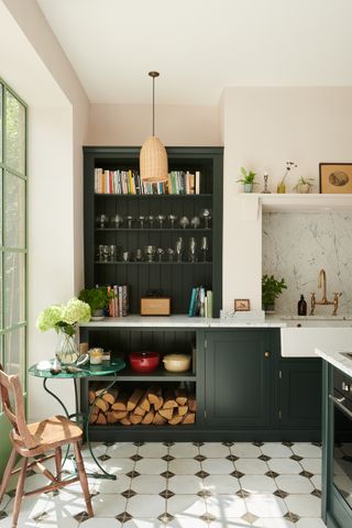 Dark green kitchen with open cabinetry