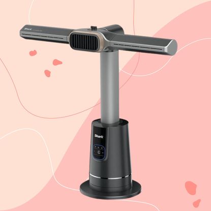 Shark TurboBlade Cool + Heat TH200UK on a pink background