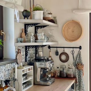 Personality filled, cozy small kitchen with coffee station area and hanging rail