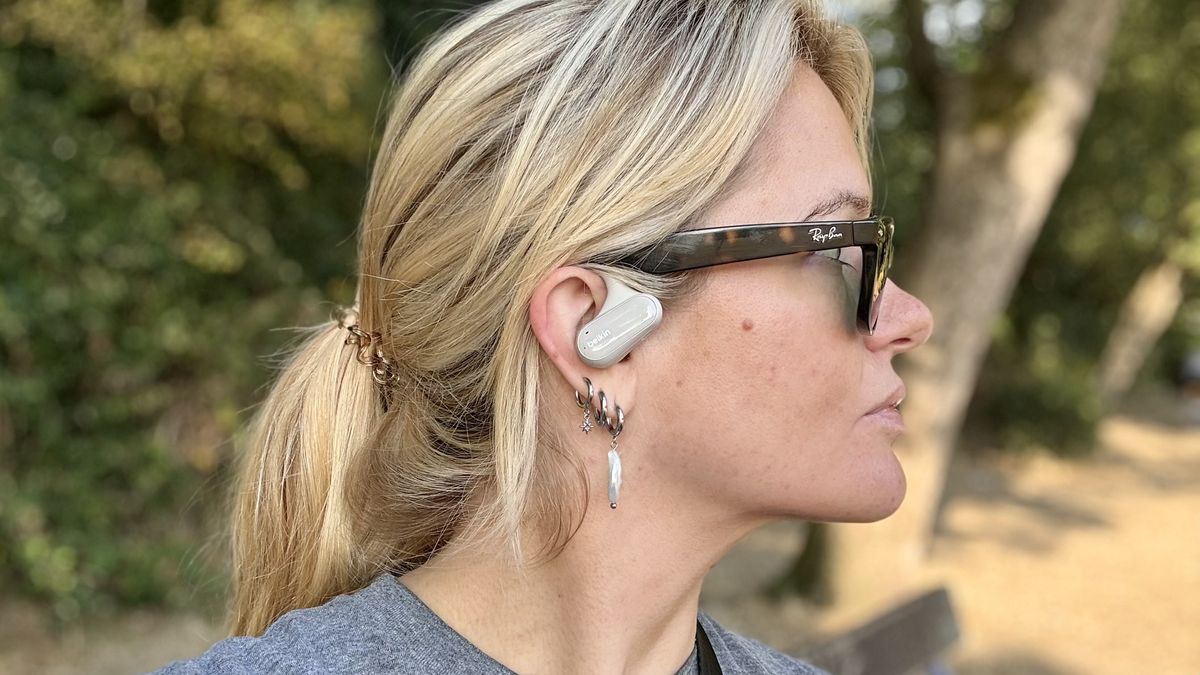 Becca Caddy wearing Belkin open earbuds for an open earbuds test