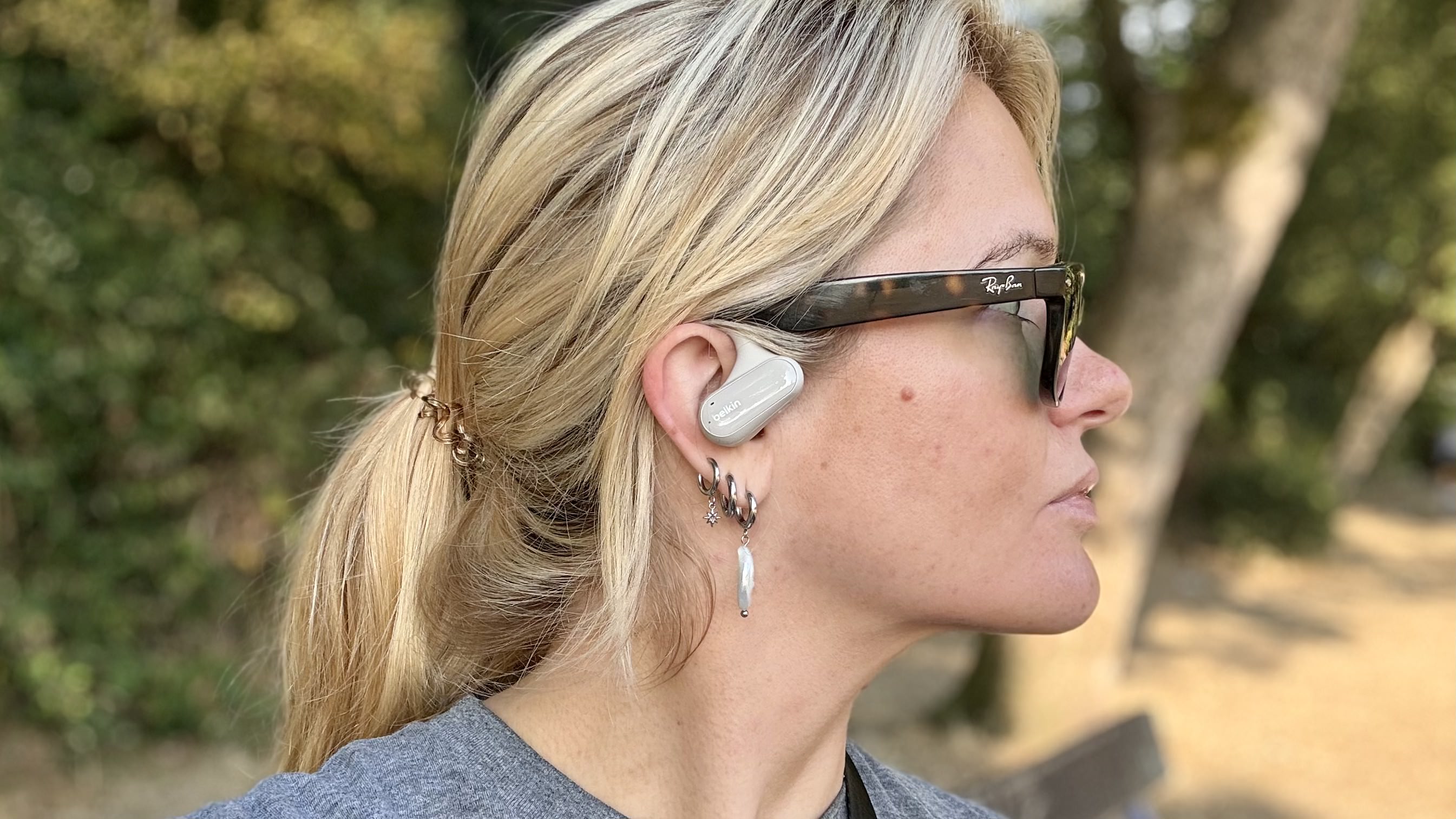 Becca Caddy wearing Belkin open earbuds for open earbuds test