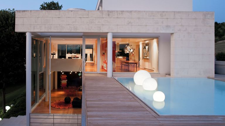 a modern house with a deck pool 