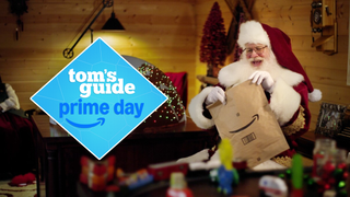 Santa holding amazon package with Tom's Guide prime day logo