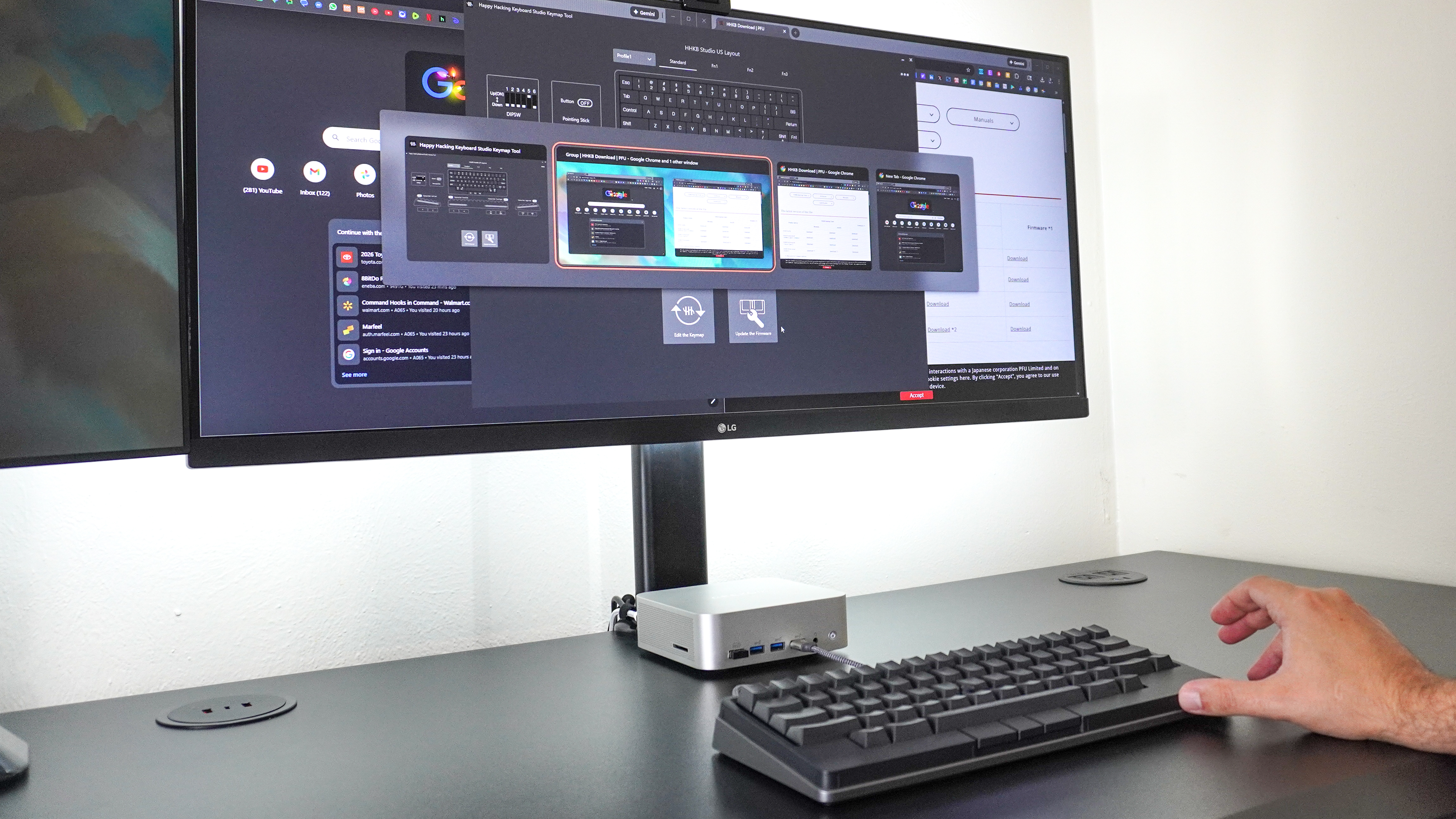 A person using the gesture pad on the front side of the HHKB Studio keyboard to switch between apps in Windows 11