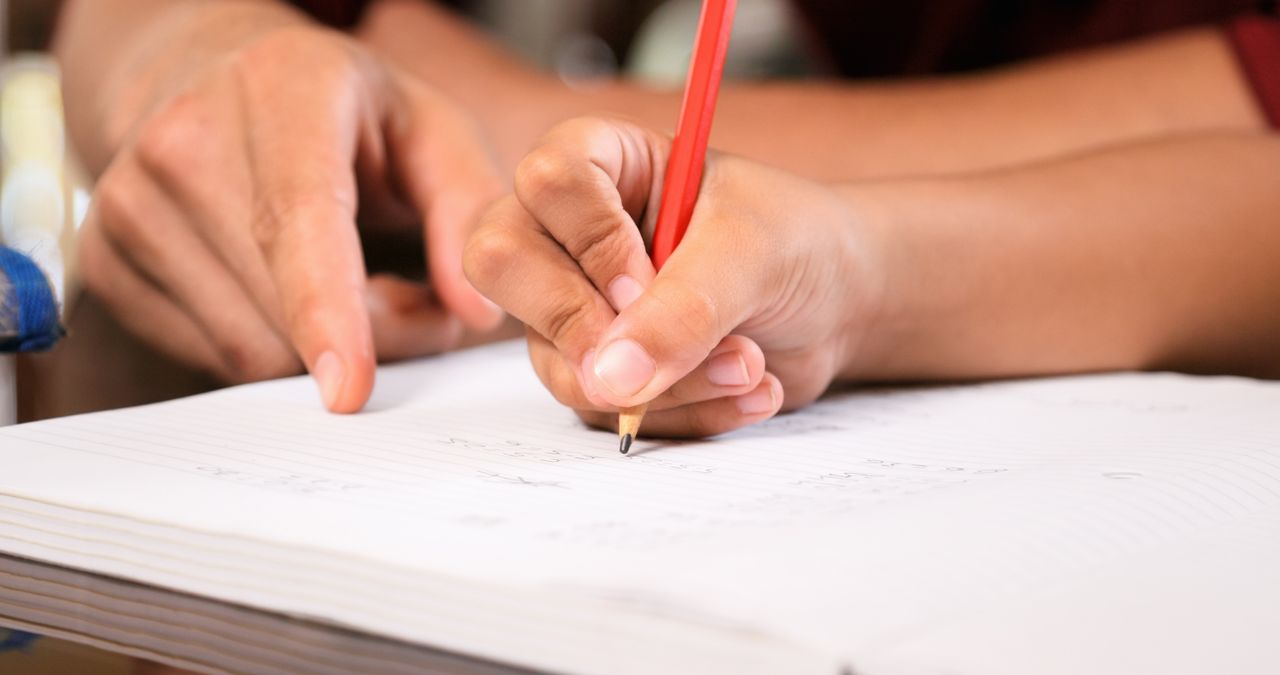 A child writing. 