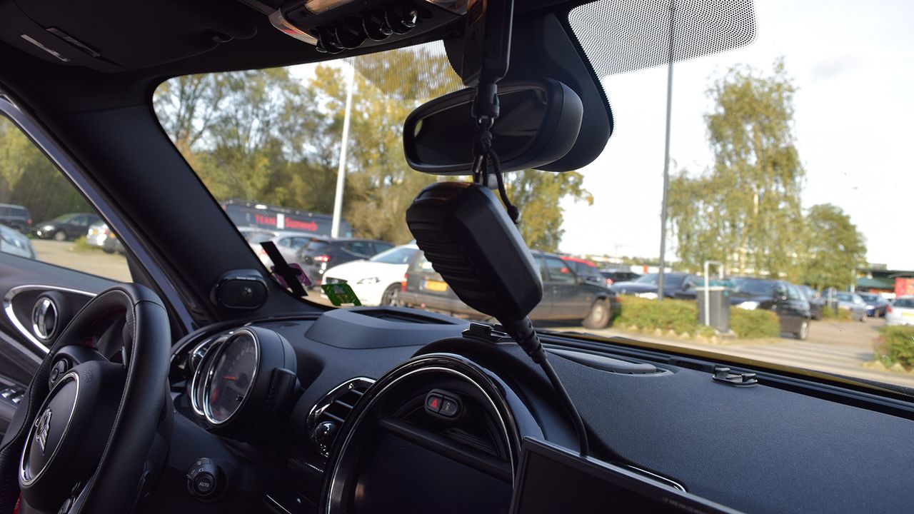 The radio sits on a stretch-cord for the DS or driver's ease of access in contacting the team