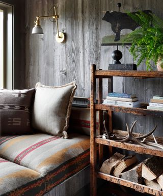 western and ralph lauren inspired couch with navajo fabrics antlers and rustic wood