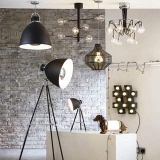 room with exposed brick wall and pedant studio floor lamps