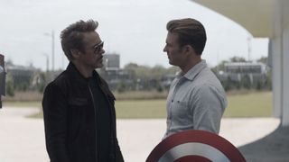 Tony Stark giving Chris Evans his shield back in Avengers: Endgame.