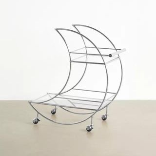 Silver moon-shaped bar cart