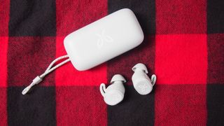 The jaybird vista 2 true wireless earbuds in white next to their charging case