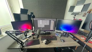 A home studio with three monitors