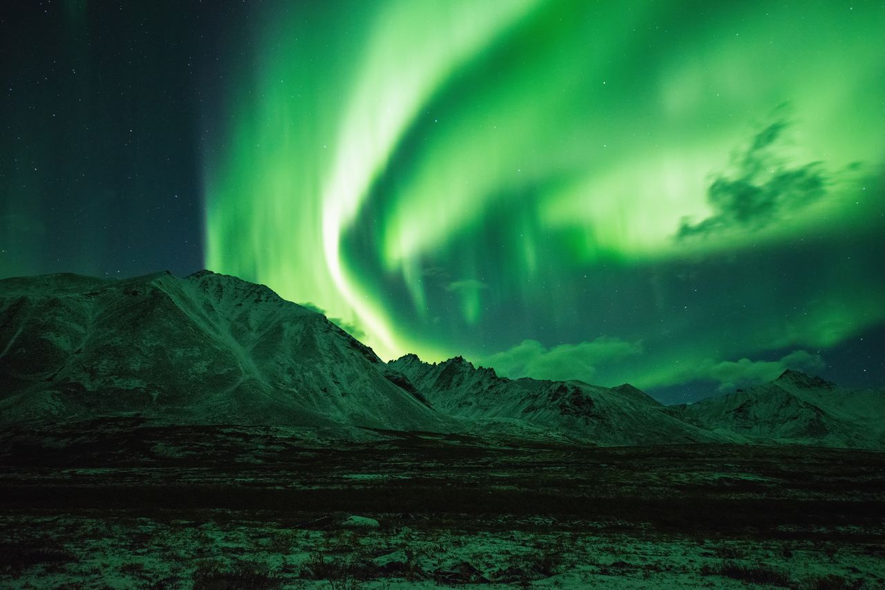 Tombstone Territorial Park, Yukon in Canada, with northern lights in the sky. 