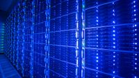 A server rack inside a data center. The entire shot is lit in stark, blue light.
