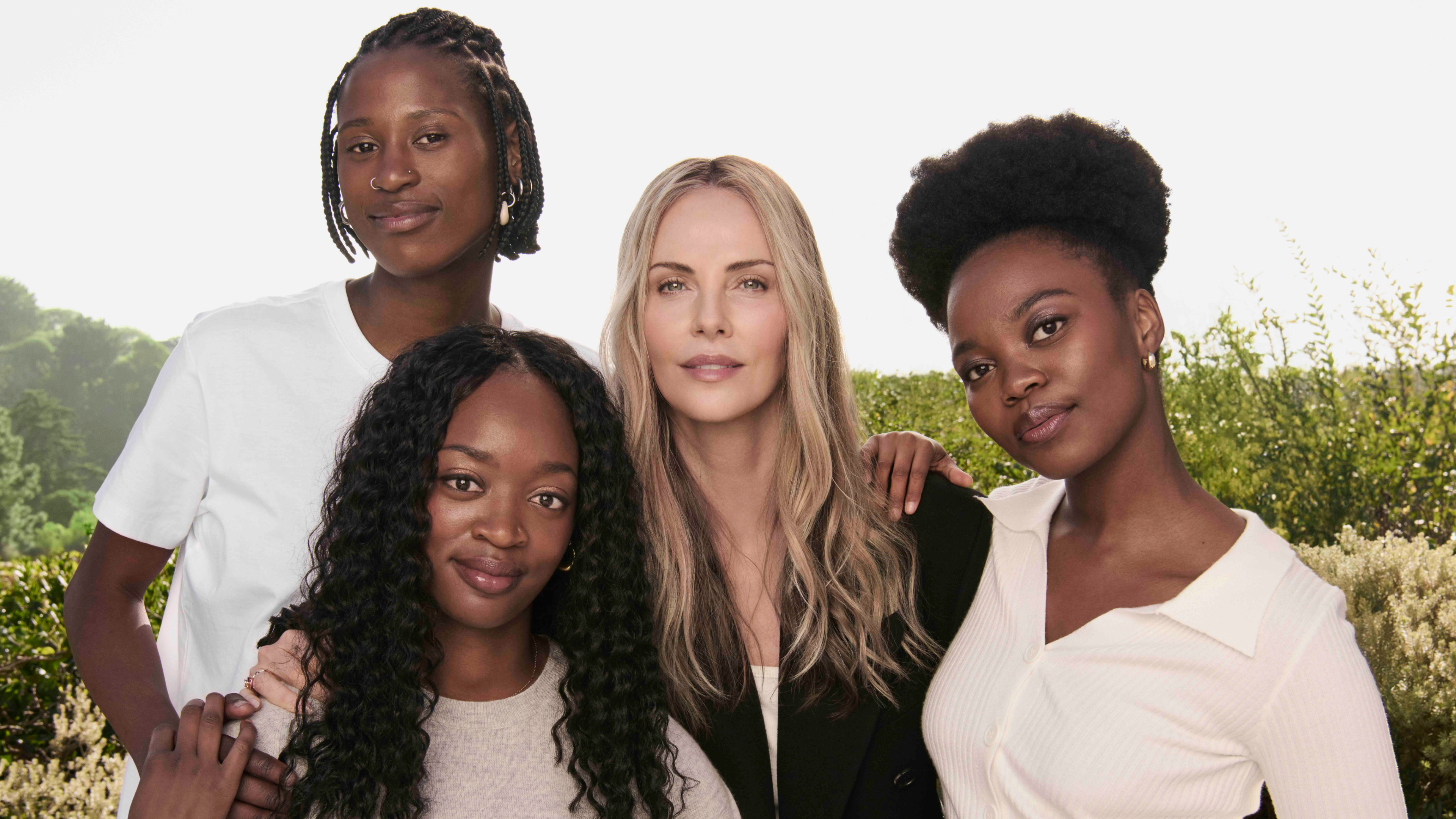 Charlize Theron and recipients of her scholarship