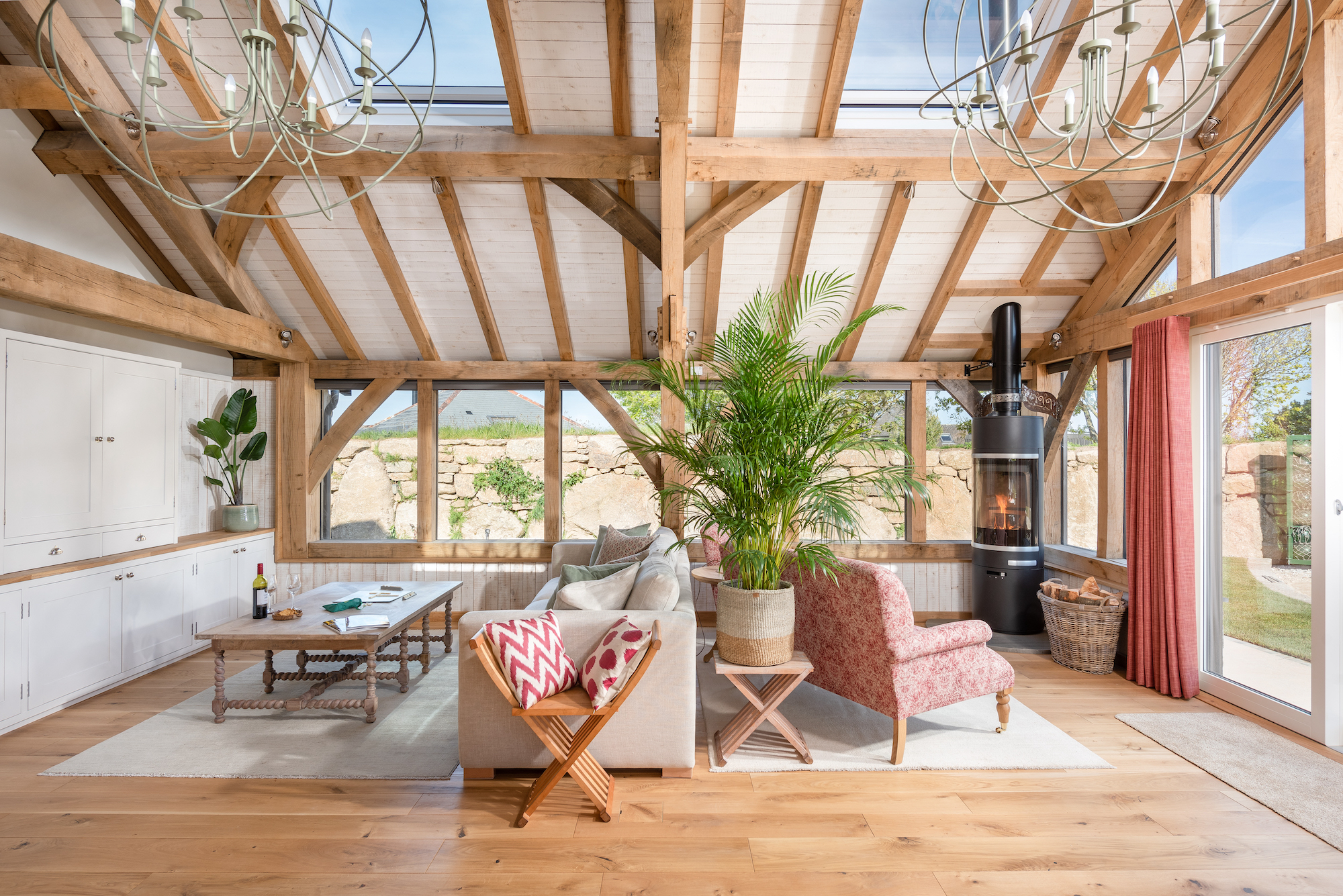living room in oak frame house with stove