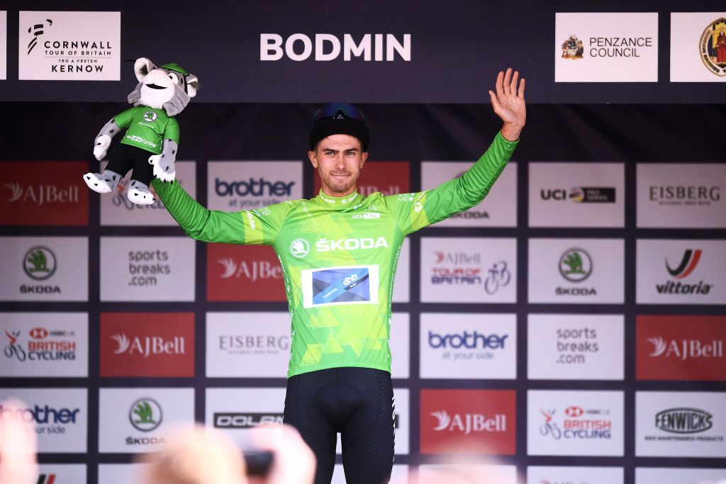 BODMIN ENGLAND SEPTEMBER 05 Jacob Scott of United Kingdom and Team Canyon DHB Sungod celebrates winning the green mountain jersey on the podium ceremony after the 17th Tour of Britain 2021 Stage 1 a 1808km stage from Penzance to Bodmin TourofBritain TourofBritain on September 05 2021 in Bodmin England Photo by Harry TrumpGetty Images