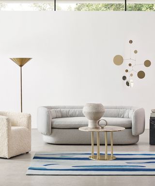 Deirdre Dyson carpet art rug with sofa, armchair and table