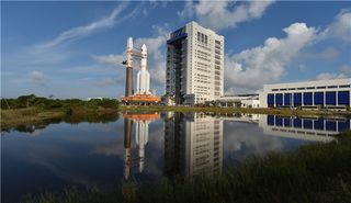 China's first Long March 5 heavy-lift rocket rolls out to its launchpad at the Wenchang launch center on Hainan Island ahead of its successful Nov. 3, 2016 launch debut.