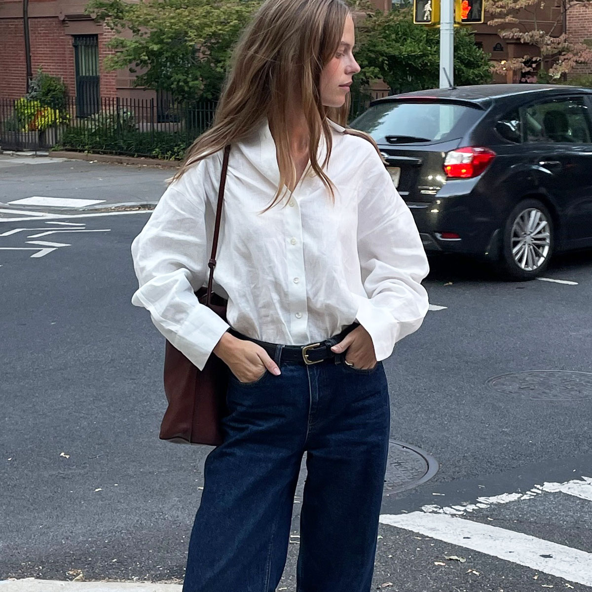 Woman in white button down and jeans