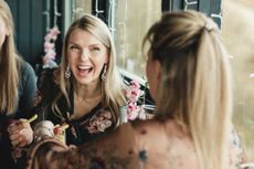 Women chatting and laughing in a restaurant