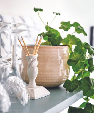 Brown plant pot, hand incense holder