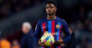 Liverpool target Ansu Fati looks on while holding the ball during the LaLiga Santander match between FC Barcelona and Sevilla FC at Spotify Camp Nou on February 05, 2023 in Barcelona, Spain.