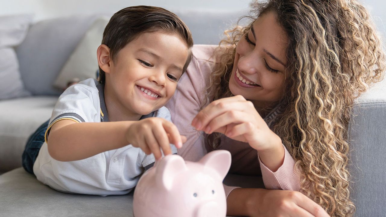 Woman, boy and piggy bank 