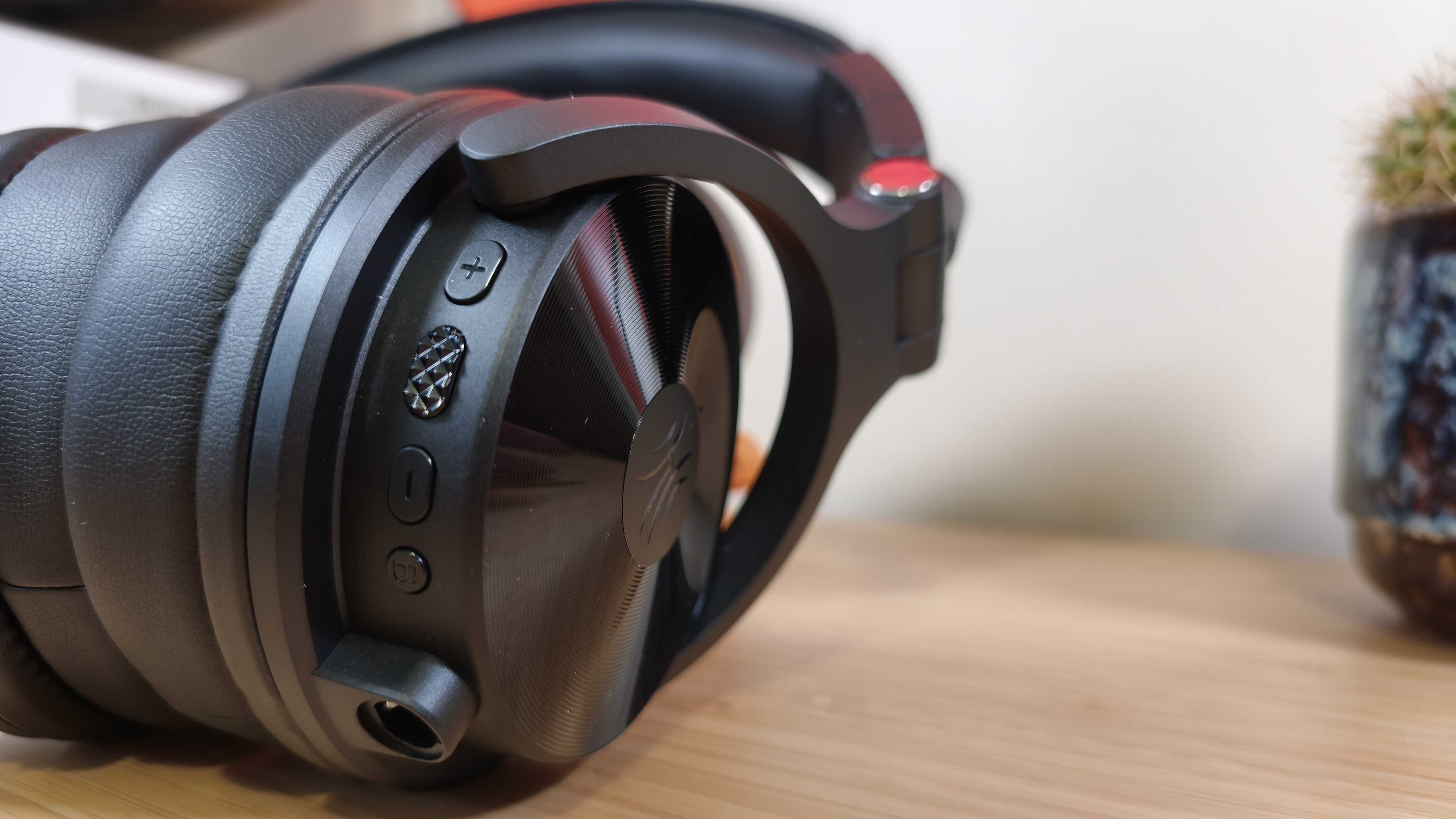 Black and red OneOdio Studio Max 1 headphones on a desk