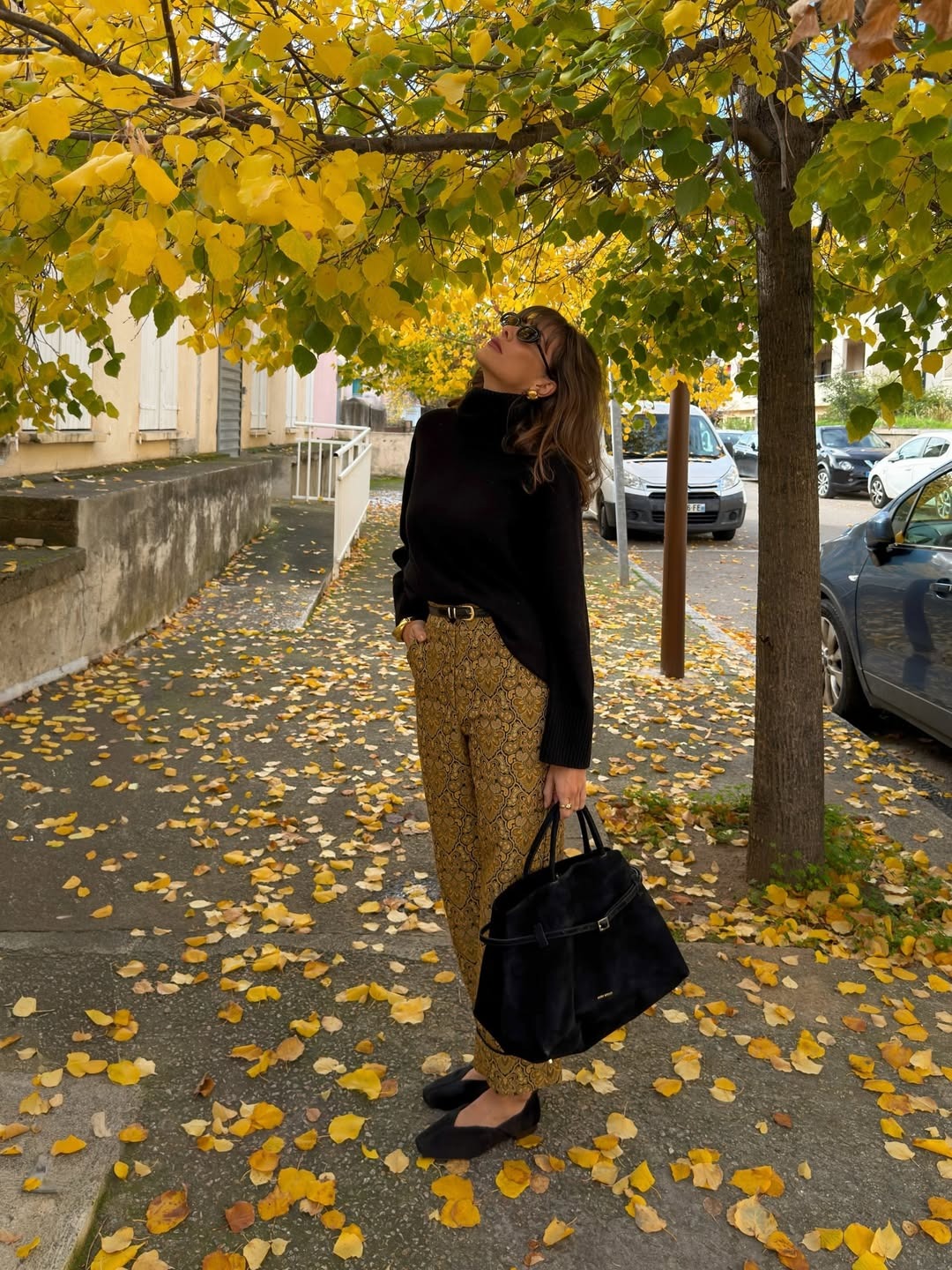 Julie Sergent Ferreri wearing a black turtleneck sweater with jacquard pants.
