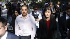 Former New York Governor Kathy Hochul aide Linda Sun, right, and her husband, Christopher Hu leave Brooklyn Federal Court after their arraignment