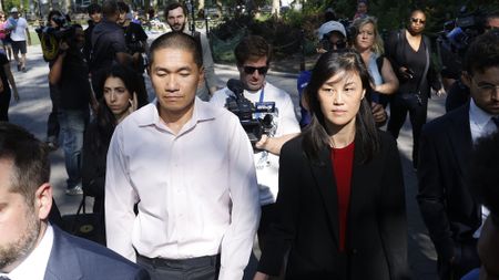 Former New York Governor Kathy Hochul aide Linda Sun, right, and her husband, Christopher Hu leave Brooklyn Federal Court after their arraignment