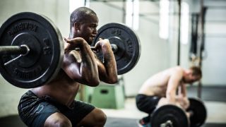 Man performs the barbell front squat