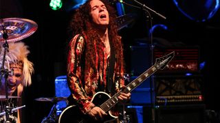 Marty Friedman, plays onstage in 2023