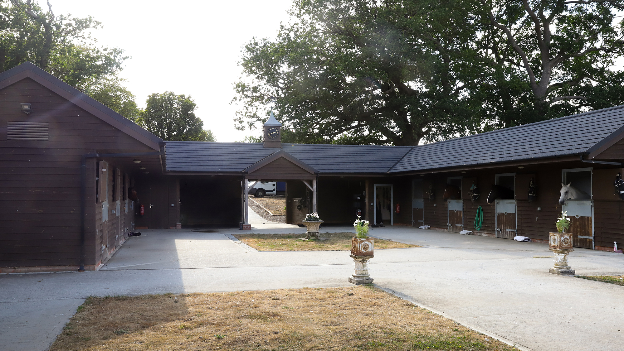 wooden stables set out in a U-shape with a central courtyard
