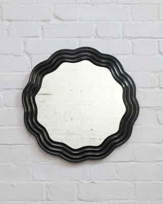 Vantage Living's round wavy mirror.