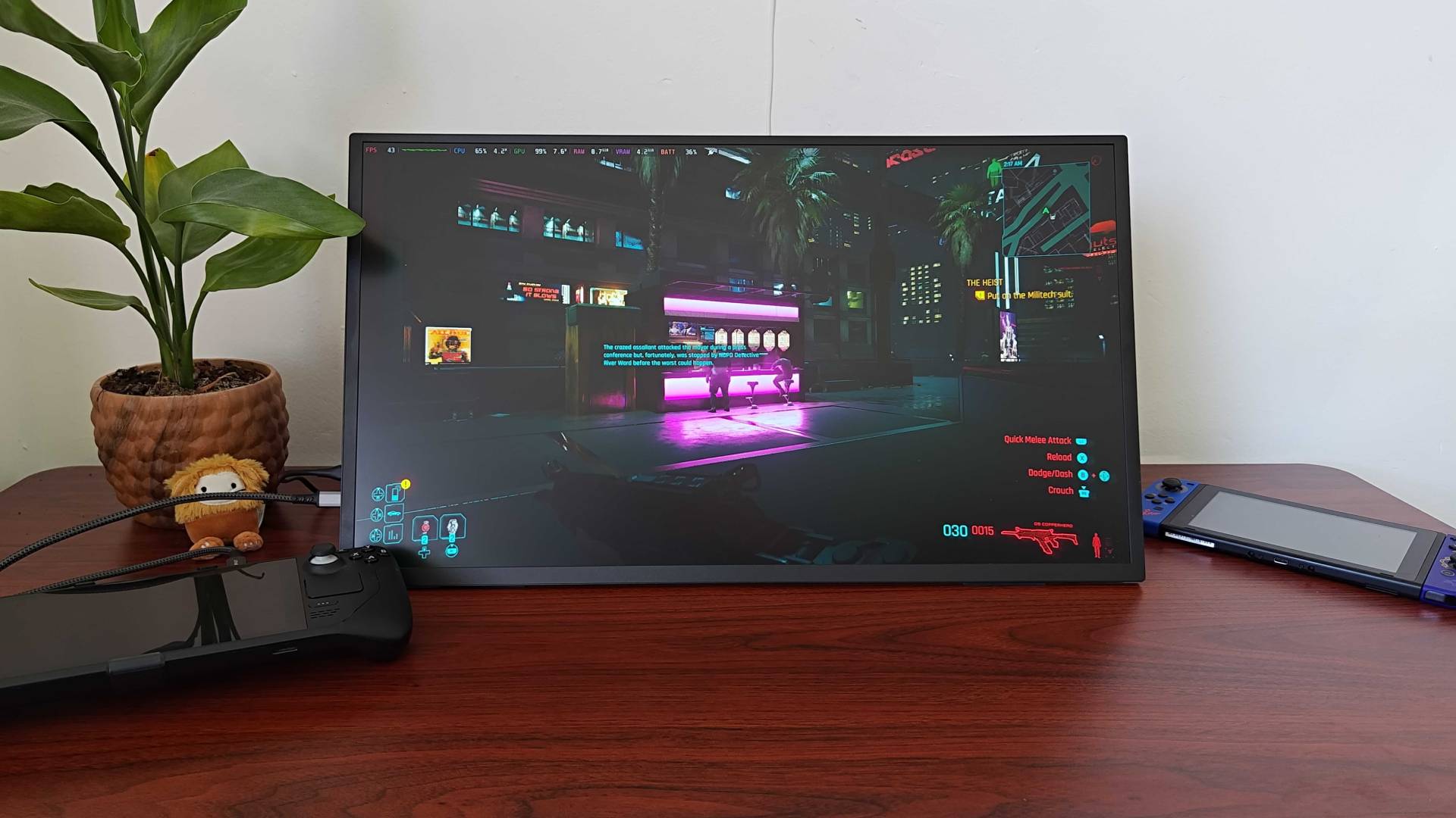 Uperfect Umax 24 portable monitor with Cyberpunk 2077 gameplay on screen via Steam Deck with HDR on.