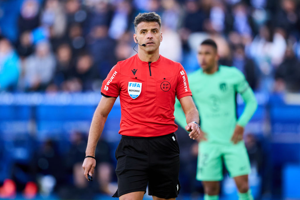 Referee Jesus Gil Manzano gestures during the LaLiga EA Sports match between Deportivo Alaves and Atletico Madrid at Estadio de Mendizorroza on April 21, 2024 in Vitoria-Gasteiz, Spain. (Photo by Juan Manuel Serrano Arce/Getty Images)