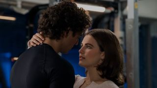 From left to right: Garrett (Belmont Cameli) looking down at Hannah (Ella Bright), and Hannah holding the back of Garrett's neck and looking up at him.