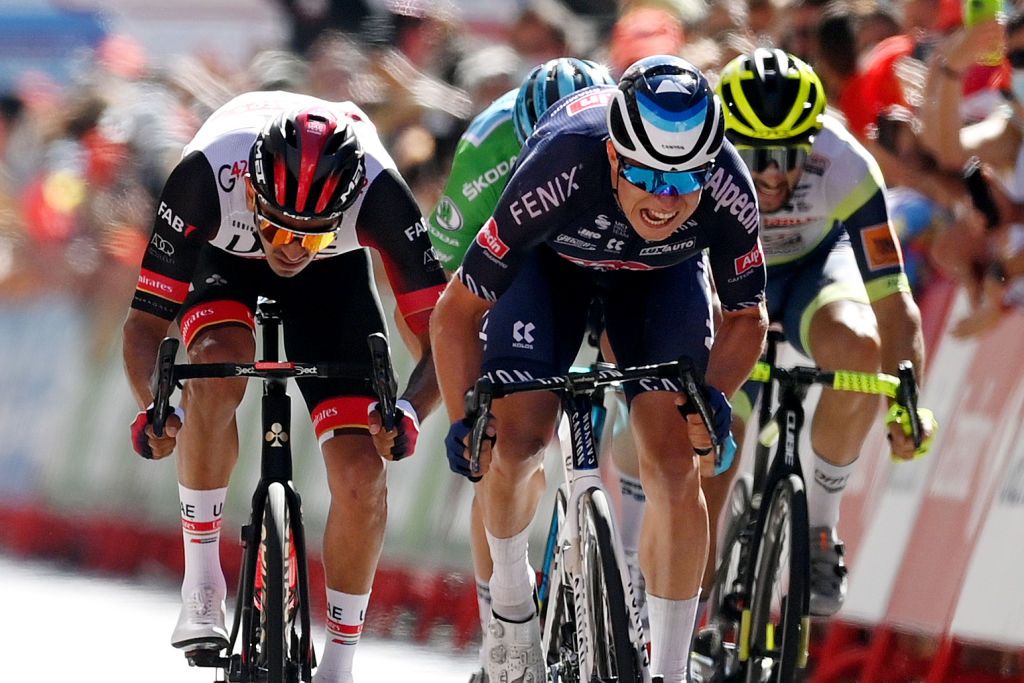 BURGOS SPAIN AUGUST 15 Jasper Philipsen of Belgium and Team AlpecinFenix sprints to winning ahead of Juan Sebastin Molano Benavides of Colombia and UAE Team Emirates during the 76th Tour of Spain 2021 Stage 2 a 1667km stage from Caleruega Monasterio de Santo Domingo de Guzmn to Burgos Gamonal lavuelta LaVuelta21 CapitalMundialdelCiclismo on August 15 2021 in Burgos Spain Photo by Stuart FranklinGetty Images