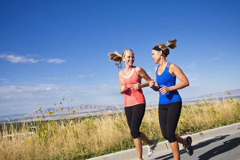 Two women jogging together