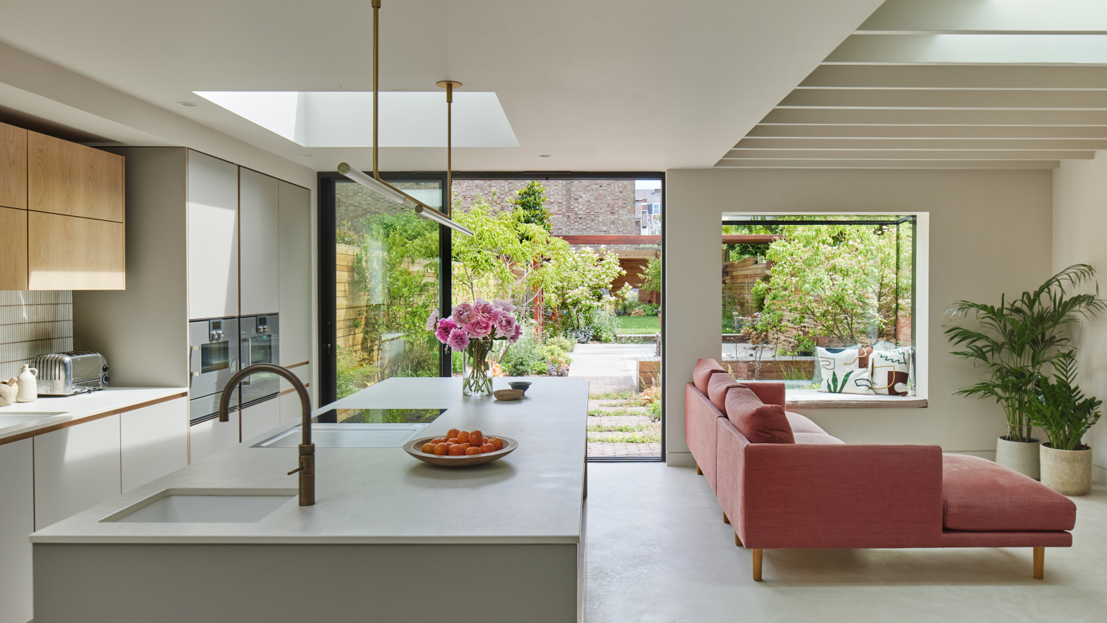 open plan basement conversion with kitchen and living room, rooflights, patio doors and large picture window