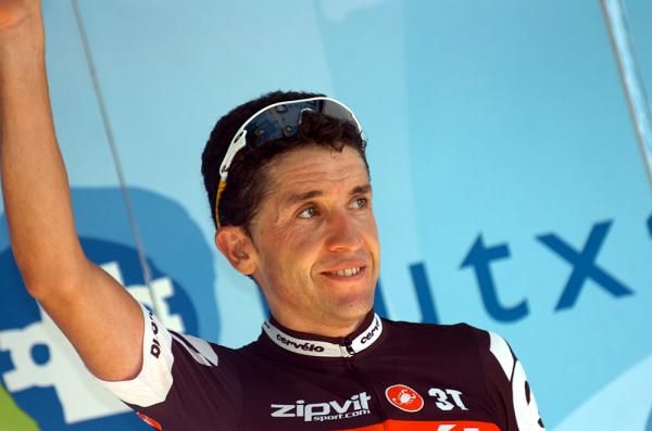 Carlos Sastre (Cervelo) steps onto the podium