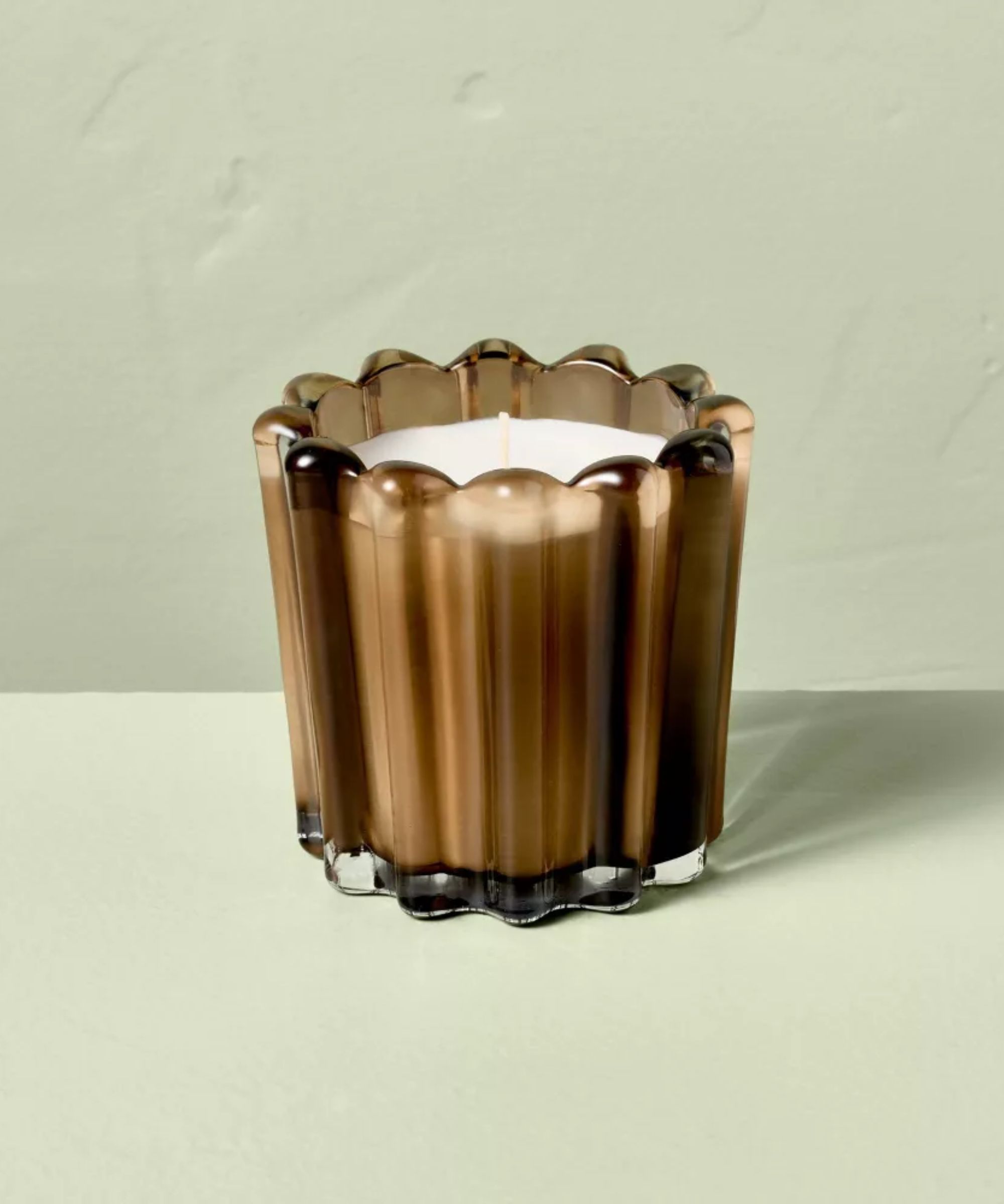 Light brown ribbed glass candle