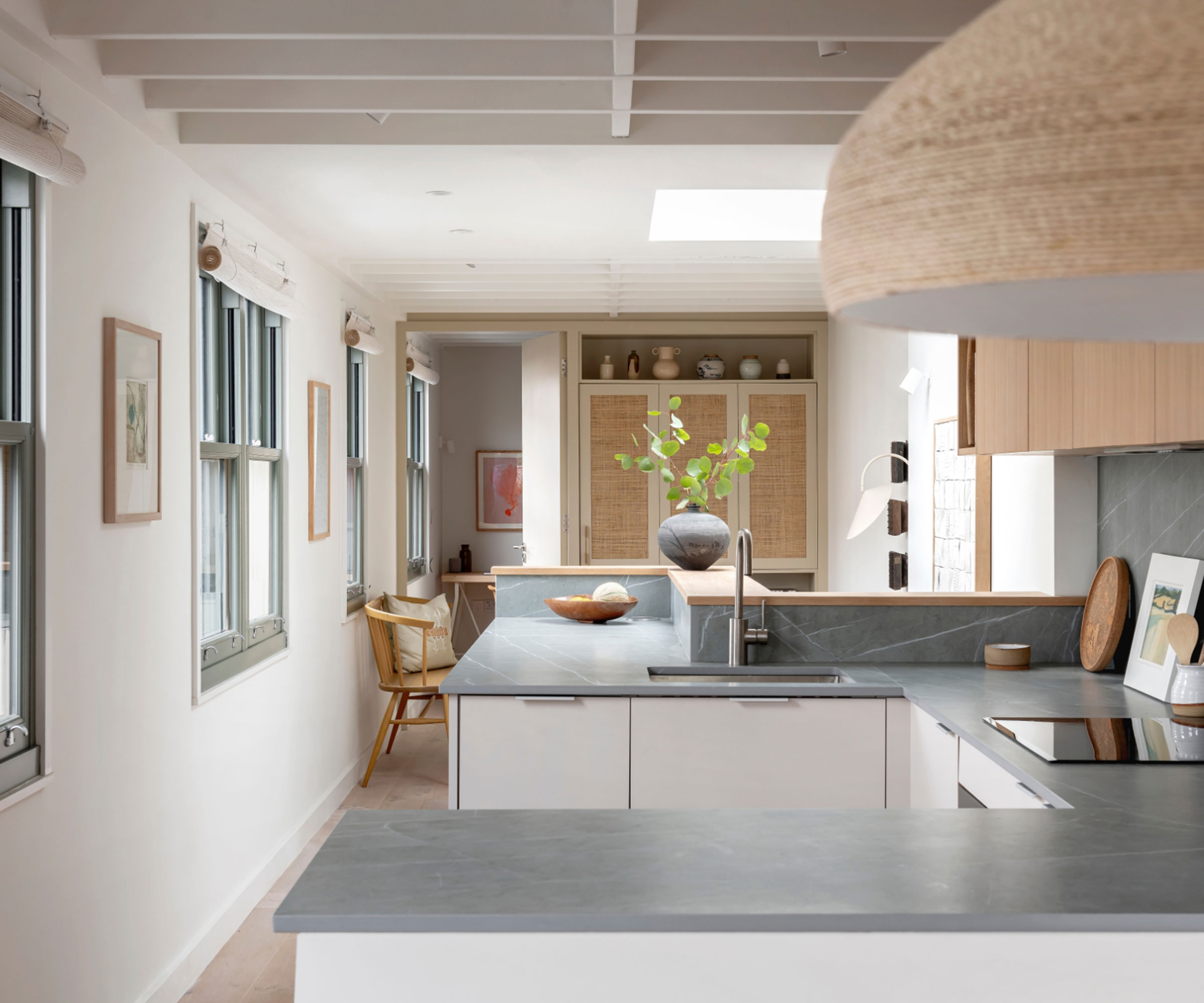 modern white kitchen diner with grey composite worktops
