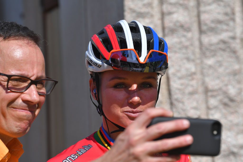 Chantal Blaak takes a photo with a fan