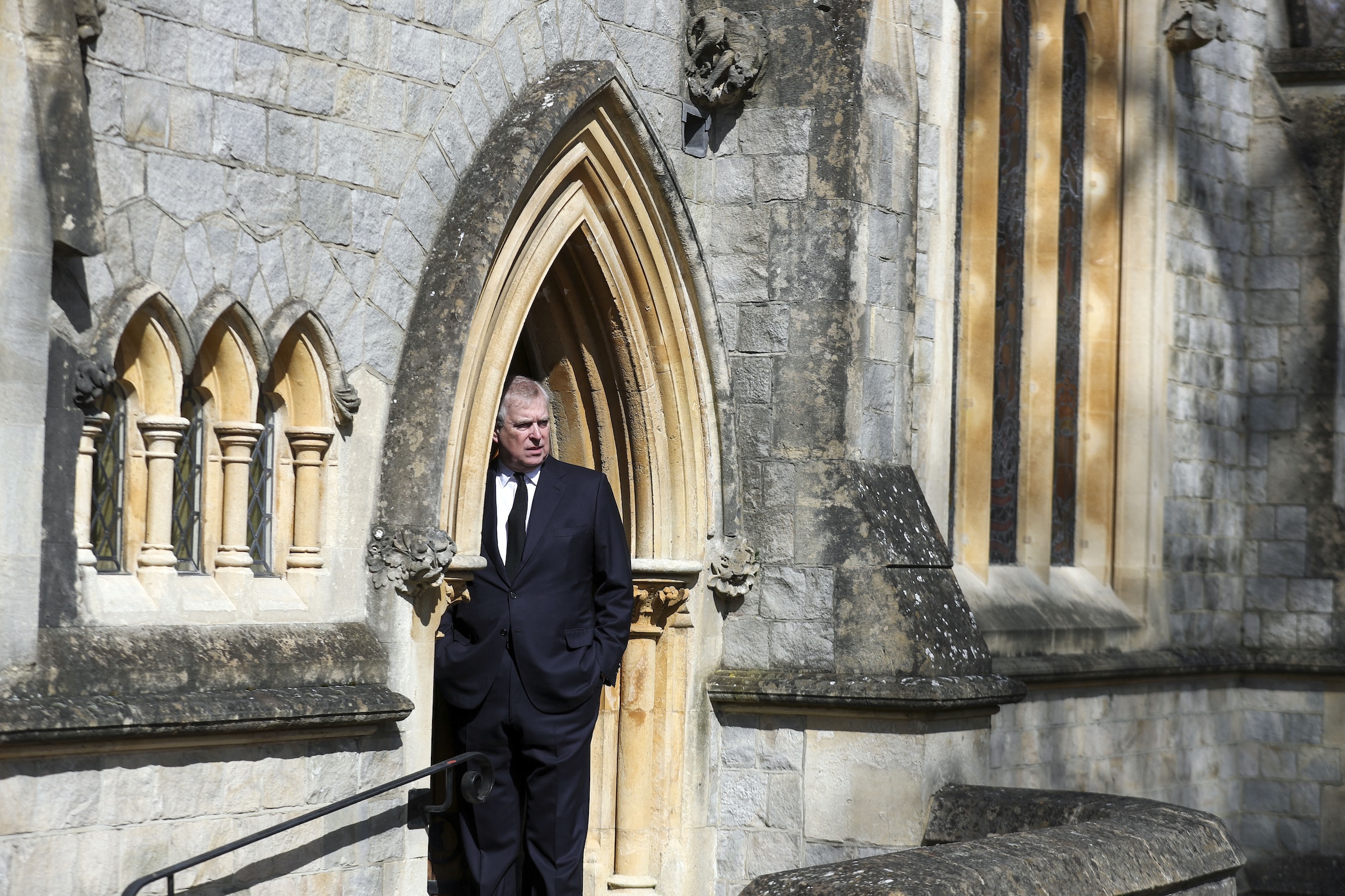 Andrew Mountbatten-Windsor standing in the doorway of the Chapel of All Souls