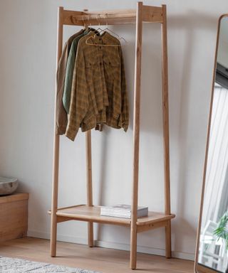 Clothes hanging on a wood rack