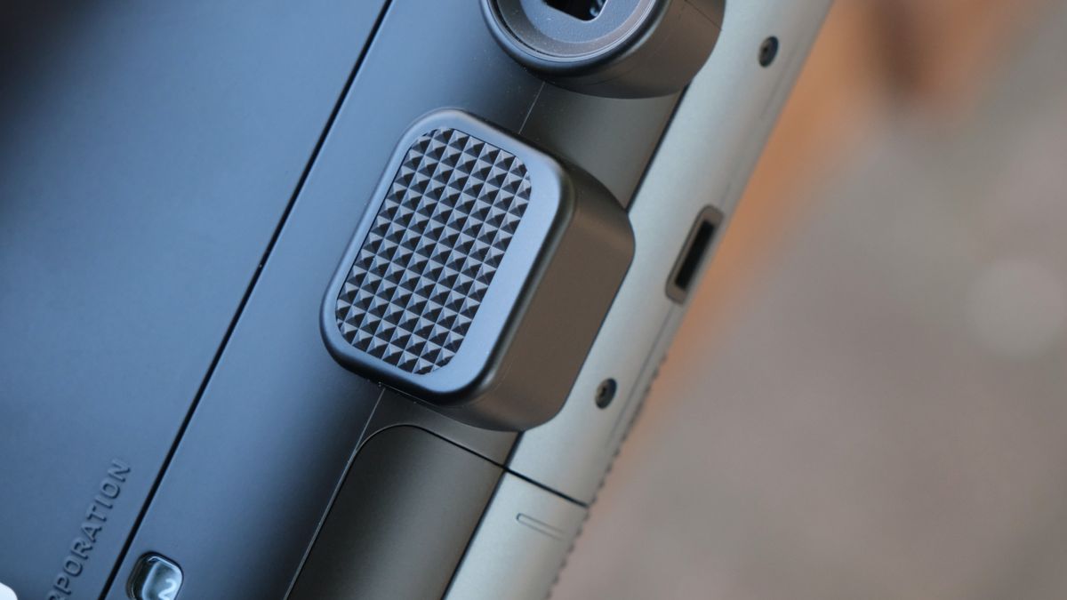 Close up of the thumb grip on a Fujifilm Instax Mini 41 camera